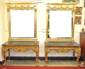 A pair of marble topped console tables (1,500-2,500)