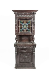 A VICTORIAN JACOBETHAN CARVED AND STAINED OAK UPRIGHT CABINET (300-500)