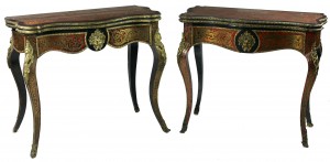 An almost matching pair of Boulle card tables (1,000-1,500).