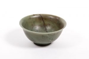 A plain Chinese gree jade bowl with Qianlong mark (5,000-6,000)