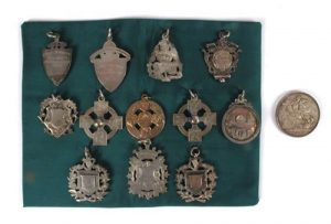 The collection of 12 Gaelic Football medals.