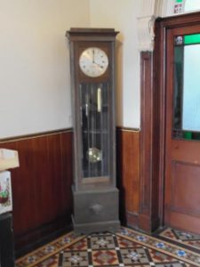A long case clock.