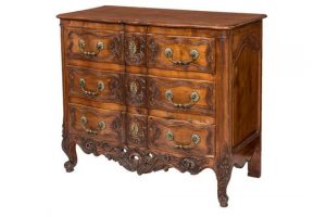 This French provincial walnut commode sold for 900 at hammer.
