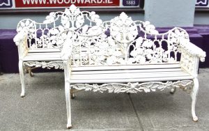 A pair of Coalbrookdale style garden seats.