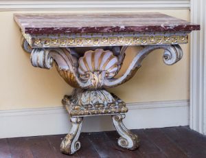 One of a pair of 18th century carved console tables which sold for 145,000 at hammer today.