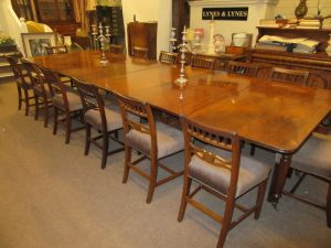 A Cork Regency dining table and a set of Georgian six bar chairs 