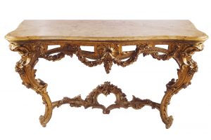 One of a pair of George III period carved gilt console tables (15,000-25,000)